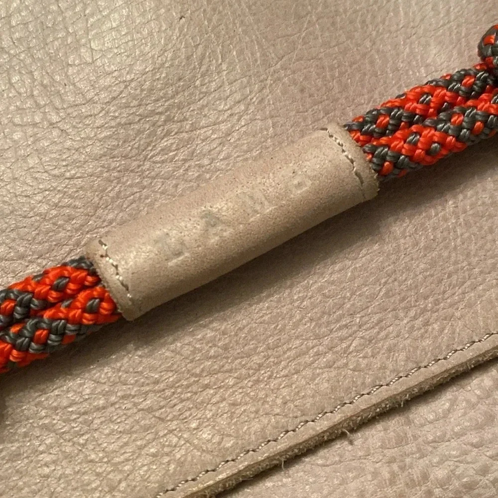 L.A.M.B. By Gwen Stefani gray Leahter clutch -orange rope detail